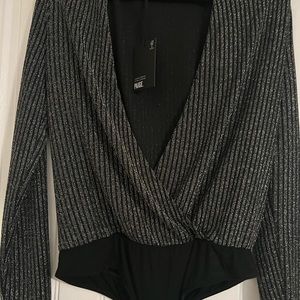 Subtle sparkle makes the Paige Julienne bodysuit an alluring option.
